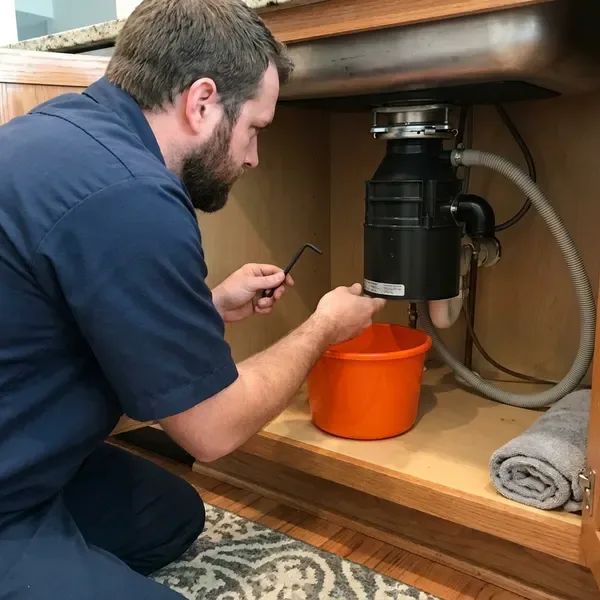 BRV Plumbing technician providing garbage disposal repair in Huntsville, AL